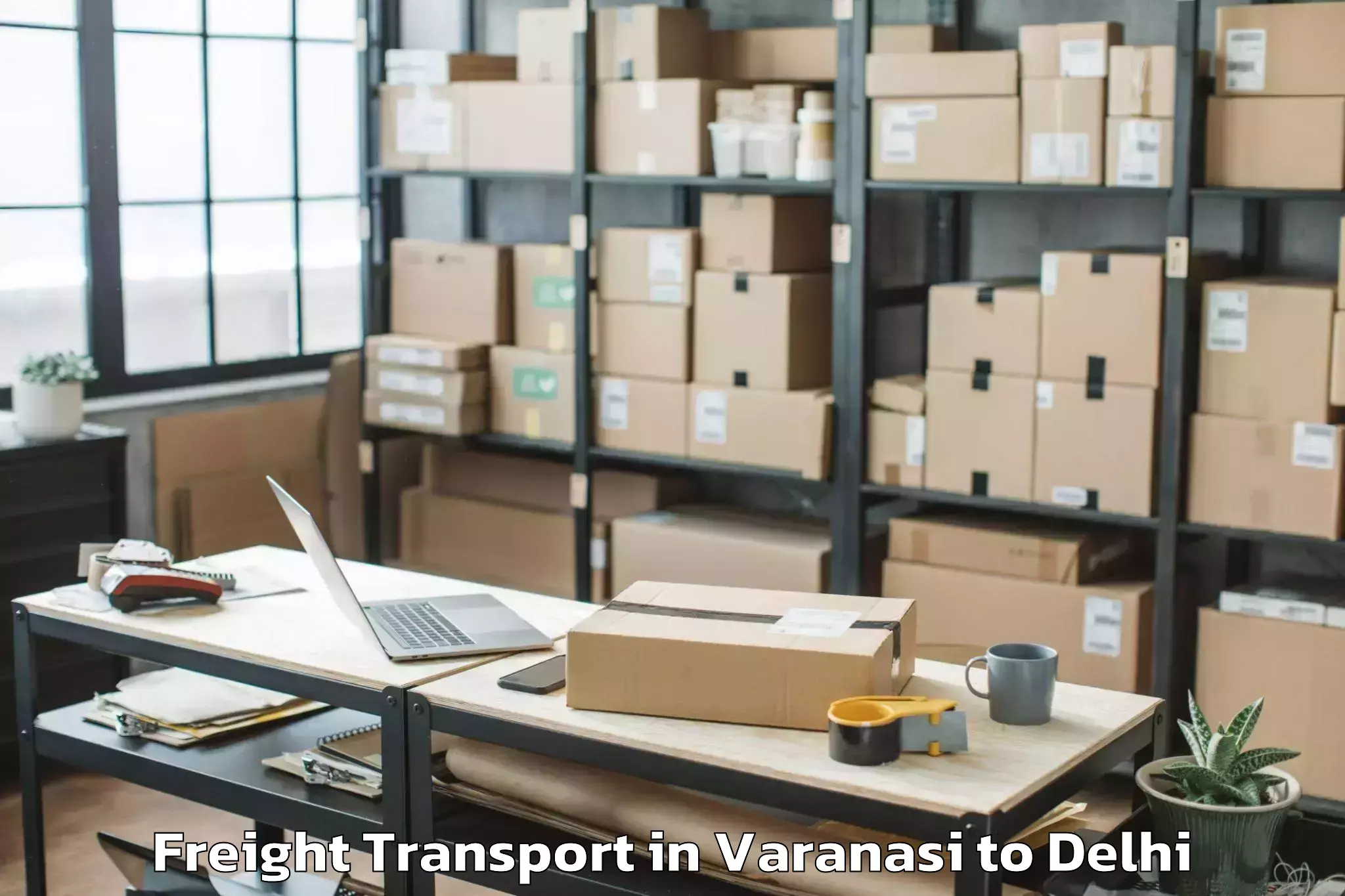 Book Varanasi to Dlf Promenade Mall Freight Transport Online